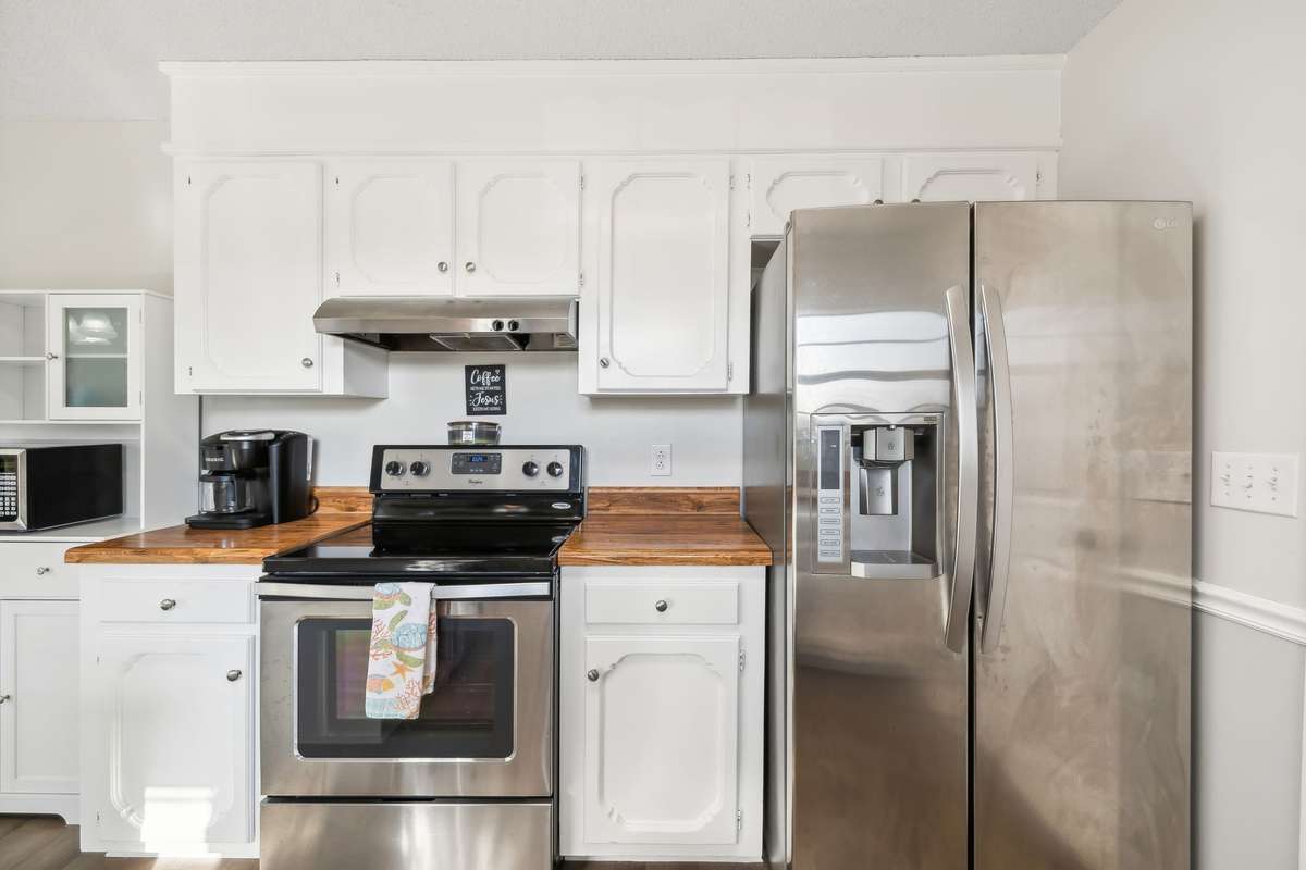 Modern stainless steel appliances and efficient layout with plenty of storage.