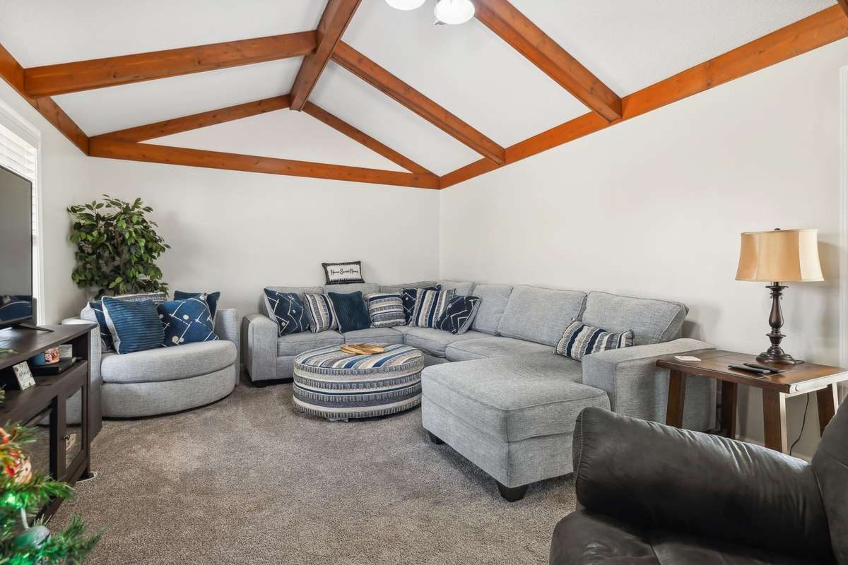 Versatile living area, perfect for entertaining, family movie nights, or game day hosting.