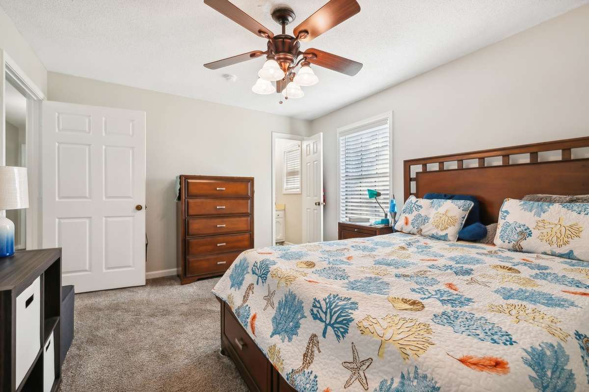 Spacious primary bedroom with natural light and ample closet space.