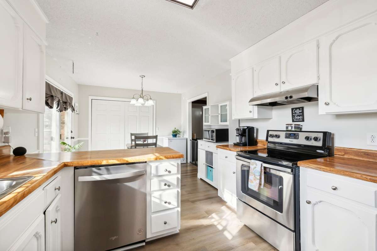 Modern stainless steel appliances and efficient layout with plenty of storage.