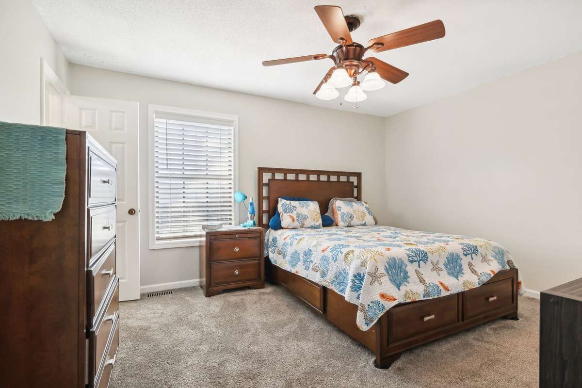 Spacious primary bedroom with natural light and ample closet space.