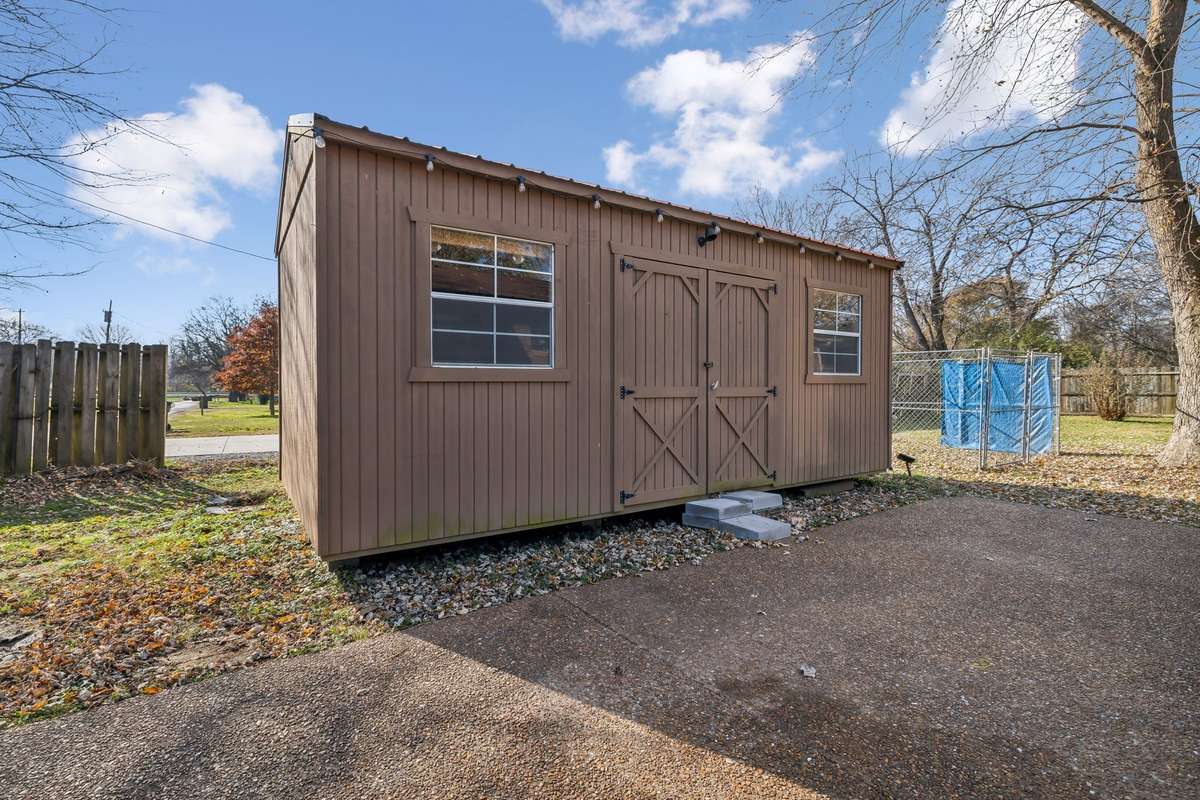 Backyard storage building for tools, hobbies, or extra space.