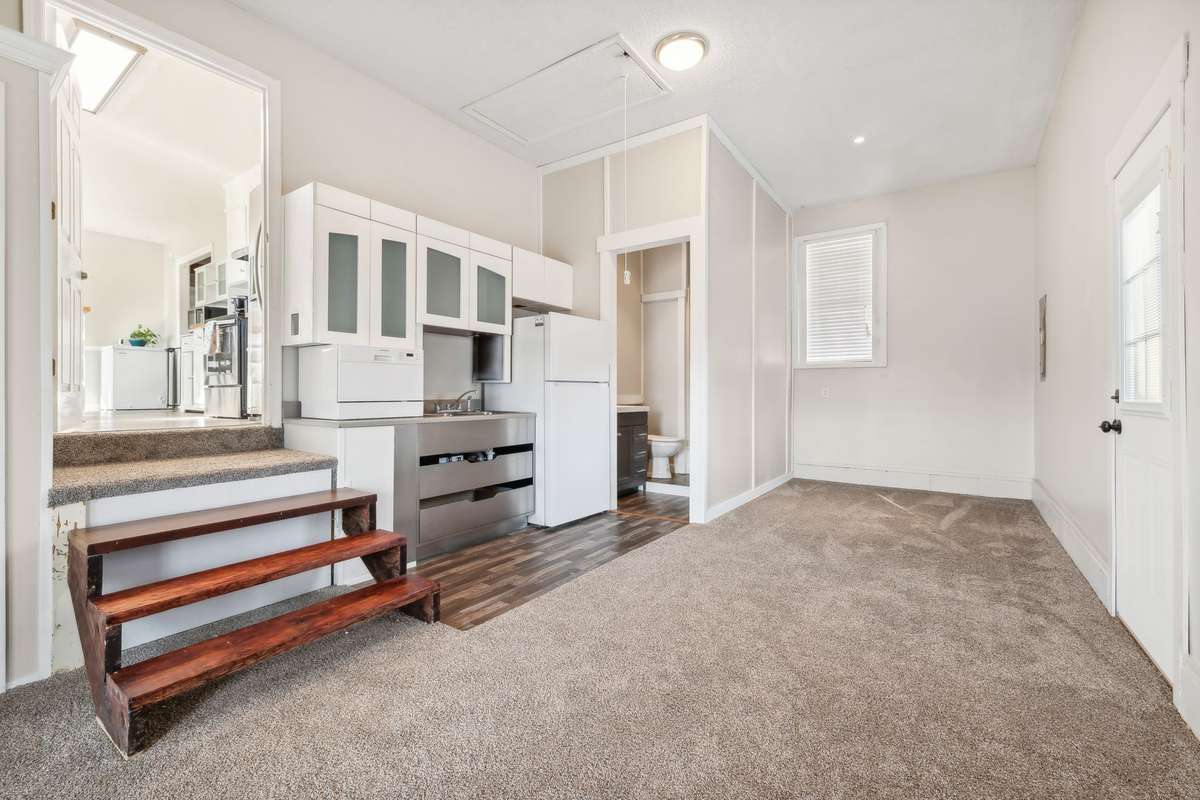 Private suite with kitchenette and bath. Flexible for rental, guests, or in-laws.