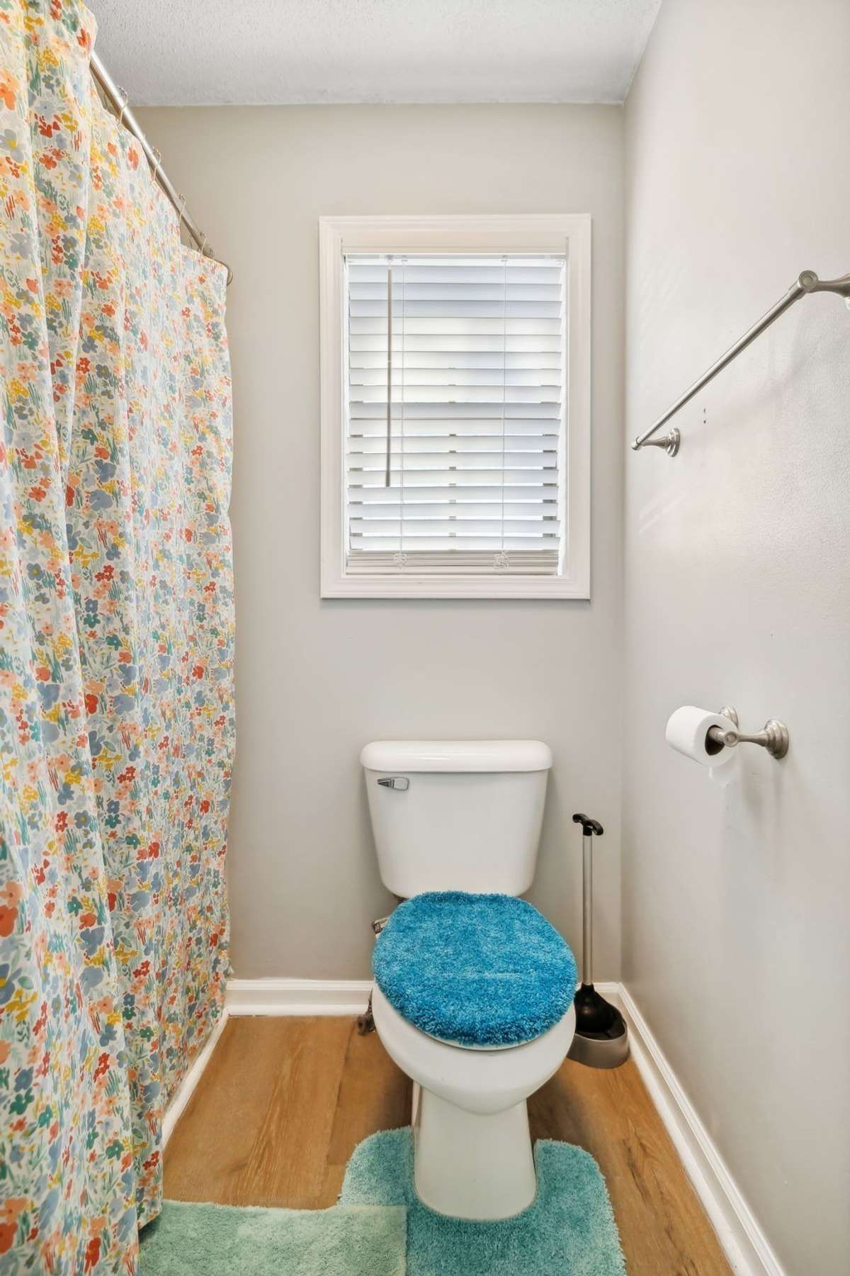 Updated bathroom with double vanity and abundant storage.