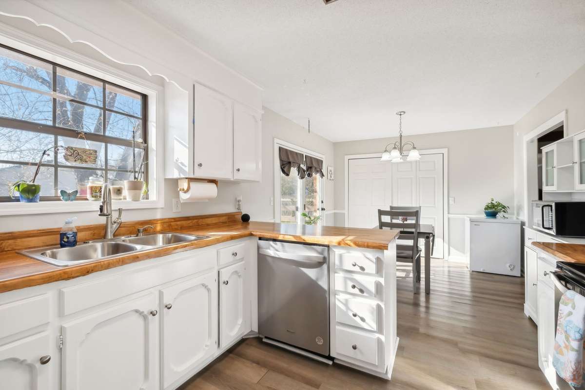 Open sight lines from kitchen to dining, easy flow for everyday living.