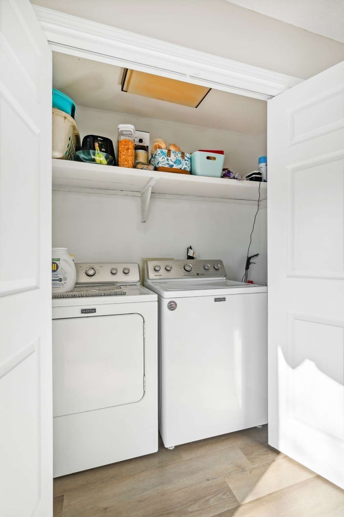 Conveniently located laundry area.