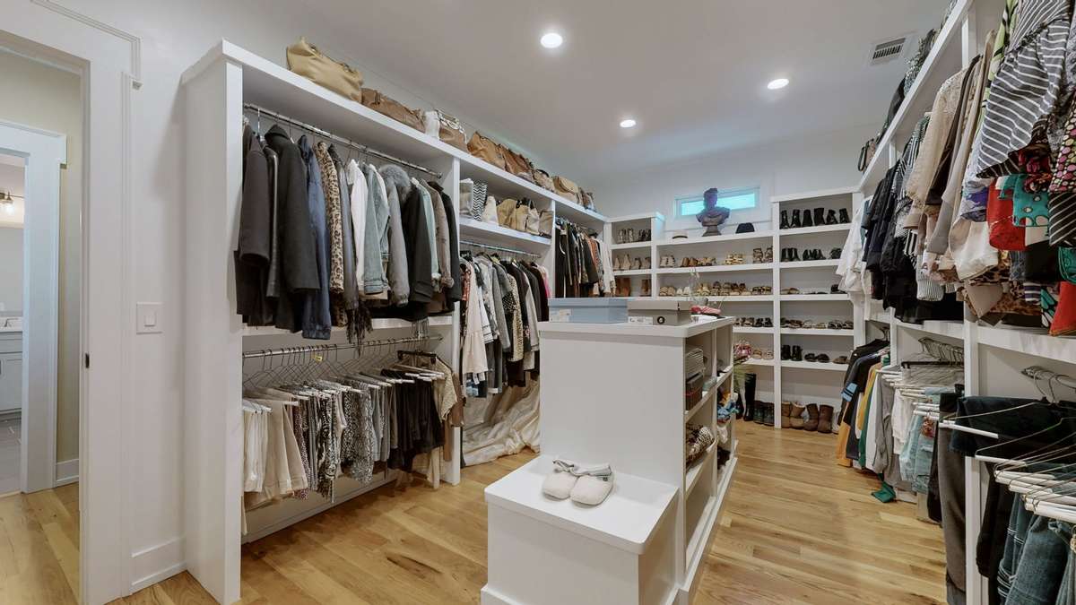 17x10 Closet with wood shelving.