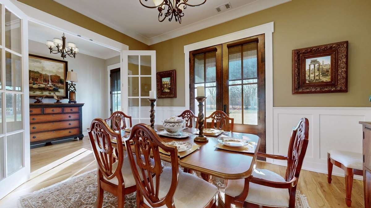 Stunning formal dining room with french doors!