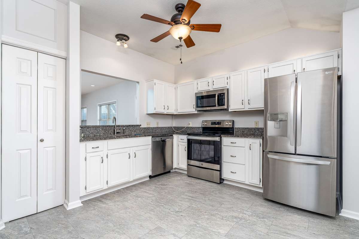 Kitchen with new floor, pantry and fresh paint including cabinets and pantry