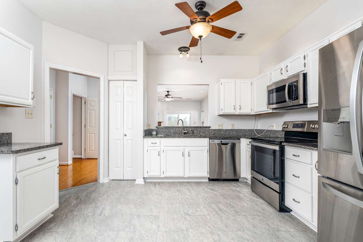 All stainless steel appliances are included - open window peeping into the Family Room