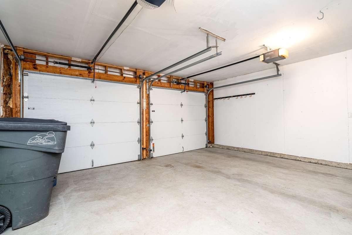 VERY Easy 4" step from Garage into your house. 2 car attached garage with room for storage.