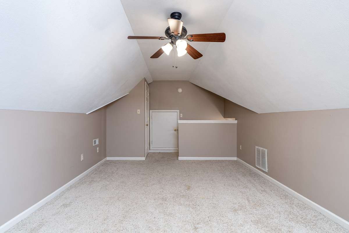 Located upstairs is the Bonus Room OR your 4th Bedroom OR excellent room for extra storage 
The small door leads to the floored attic