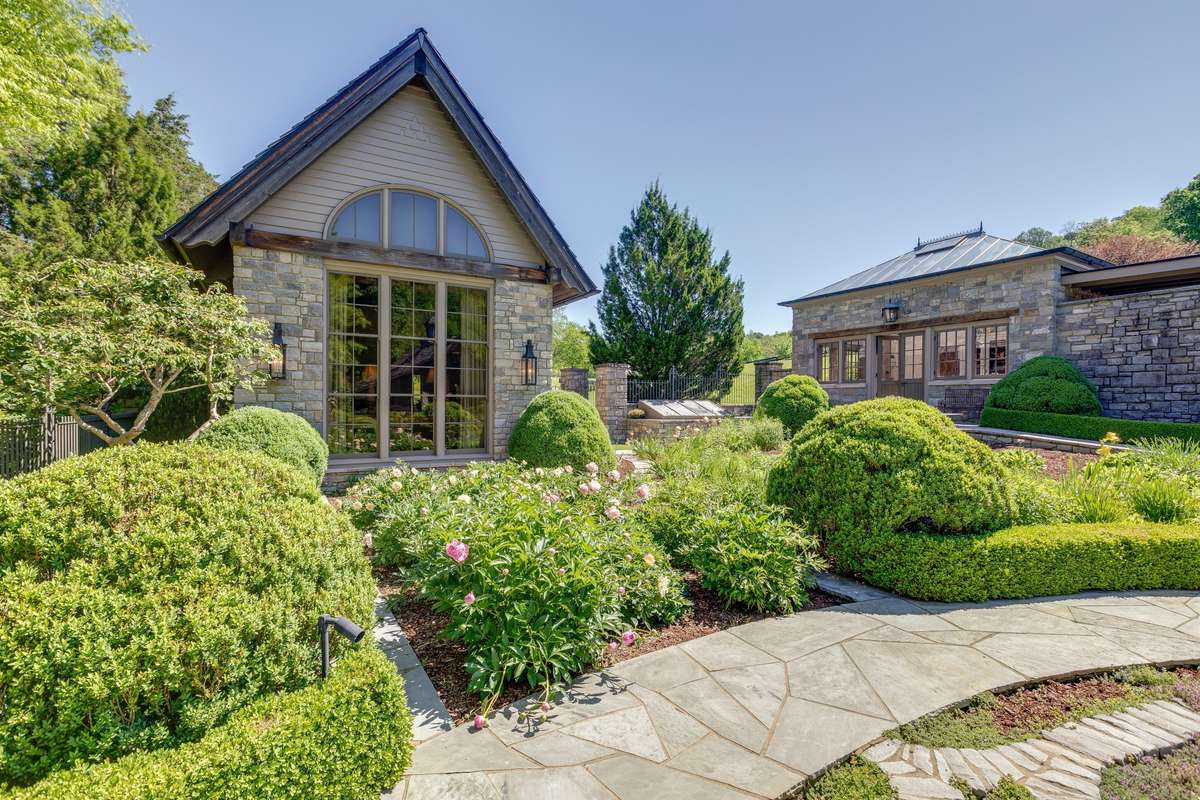 Stone path leads through multiple "rooms" in the garden