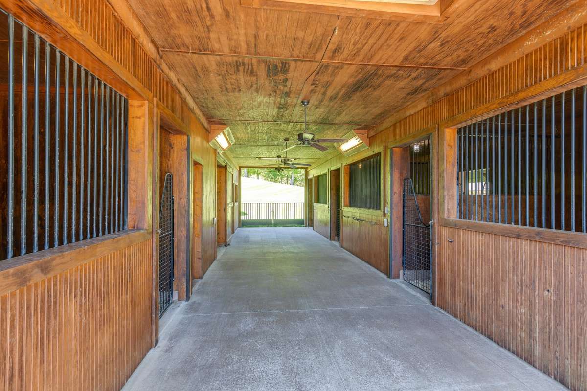 Auto water in 4 stalls, huge hay loft, wash room, tack room