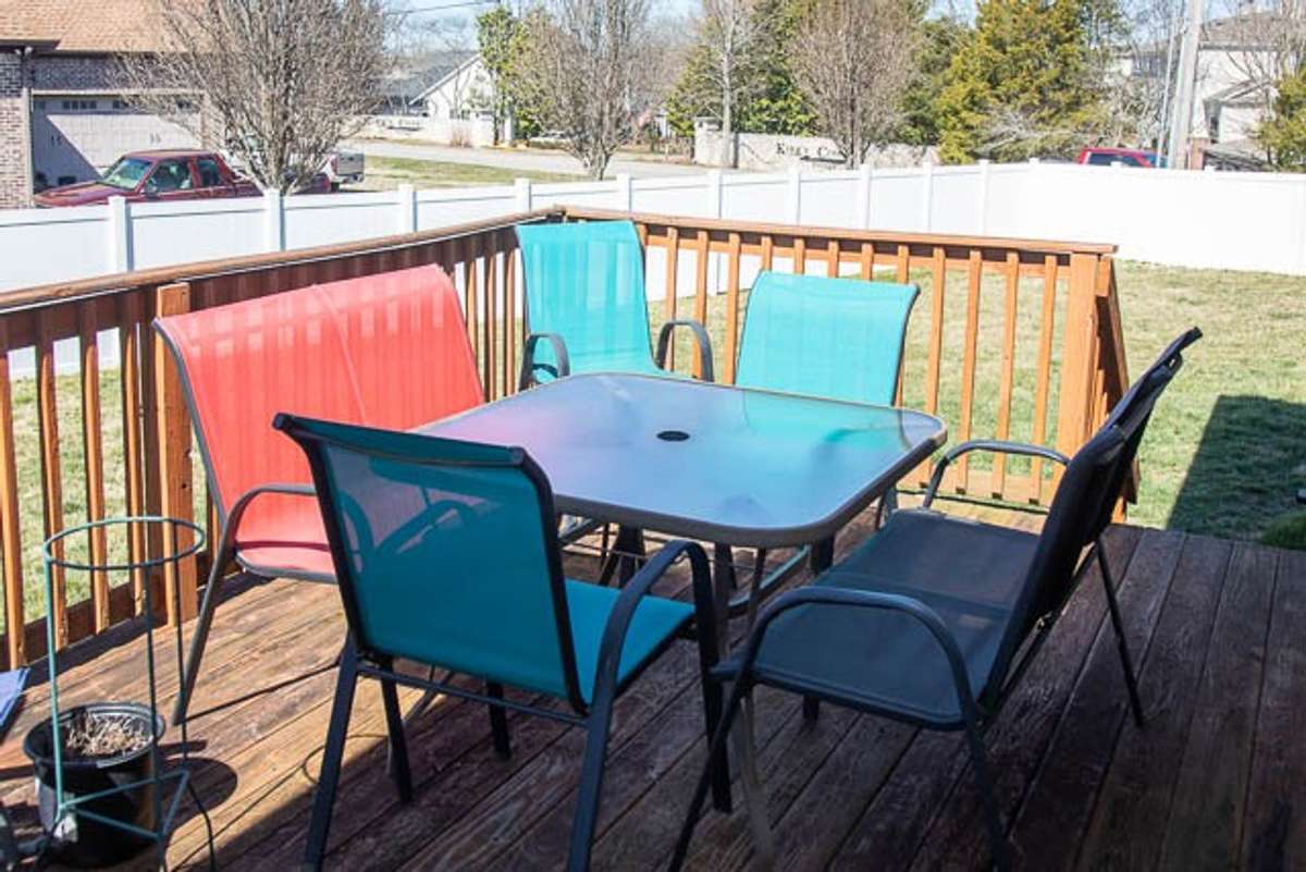 Deck overlooking the fenced backyard