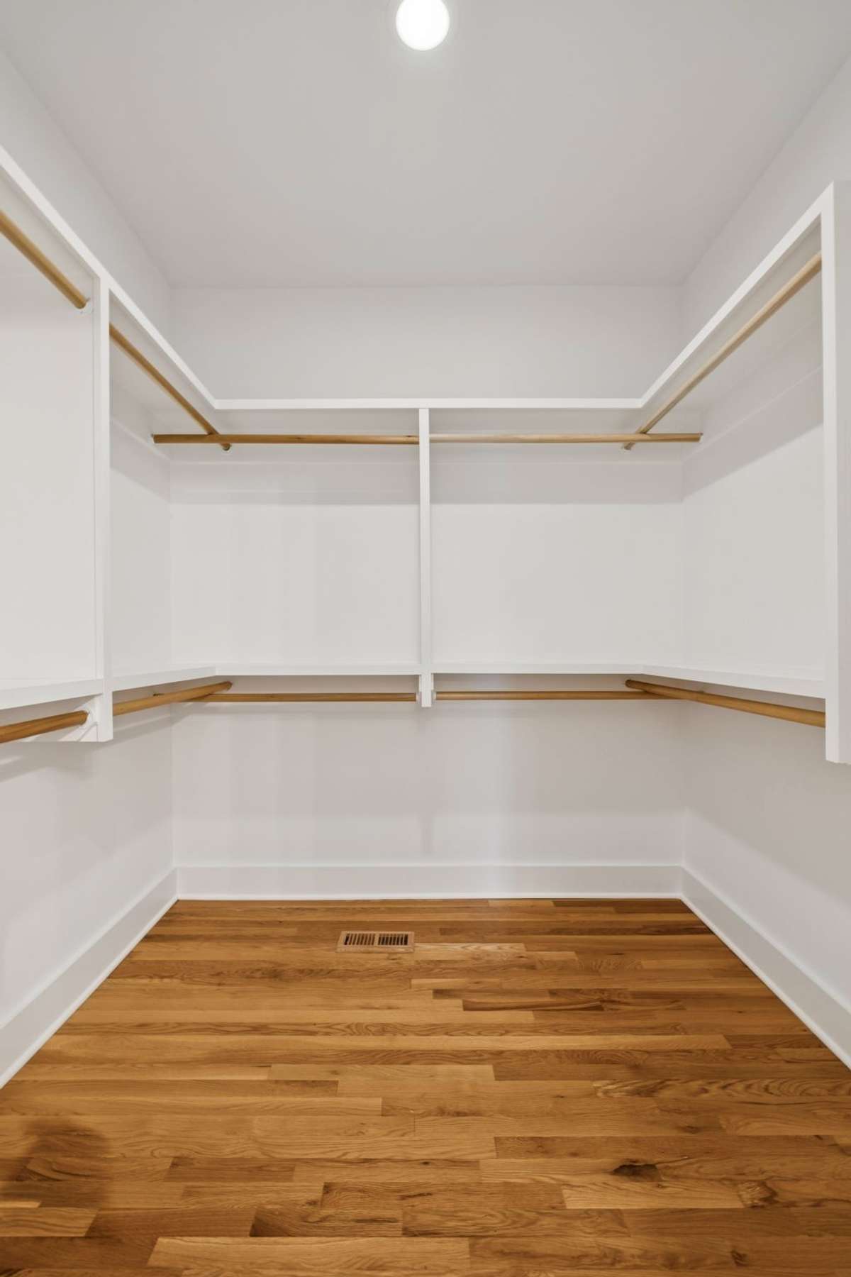 This is the expansive walk-in closet in the primary suite.