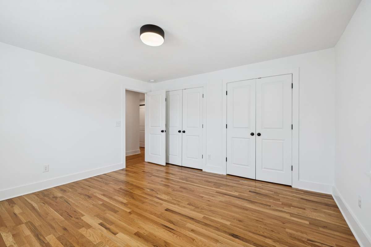 This is the second bedroom - located at the front of the house.  It has an extra large closet with two sets of double door.