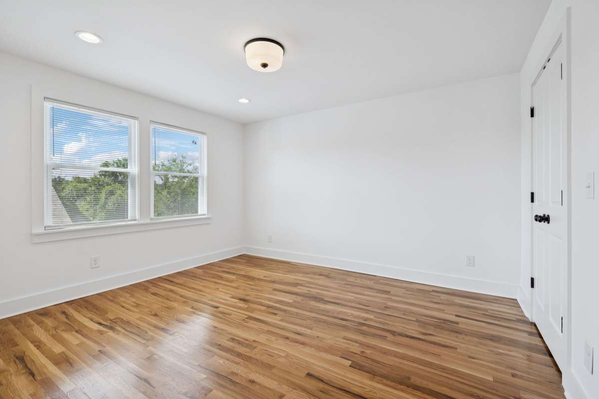 This is bedroom #4, located on the second floor.  It's 16x11 and features two sets of double doors that open to a large closet.