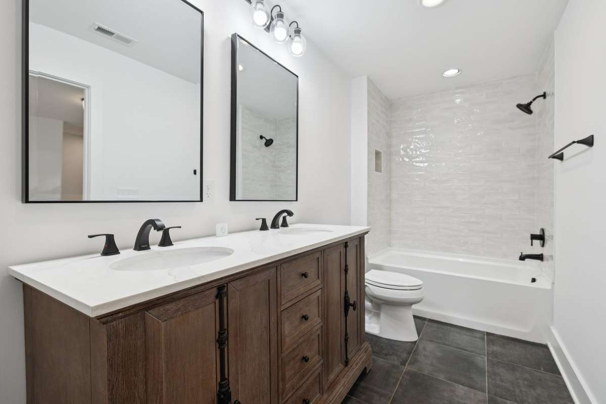 The second floor bathroom is 14x5 and features a double vanity along with shower/tub combo.  It services the two second floor bedrooms and the flex bonus area.