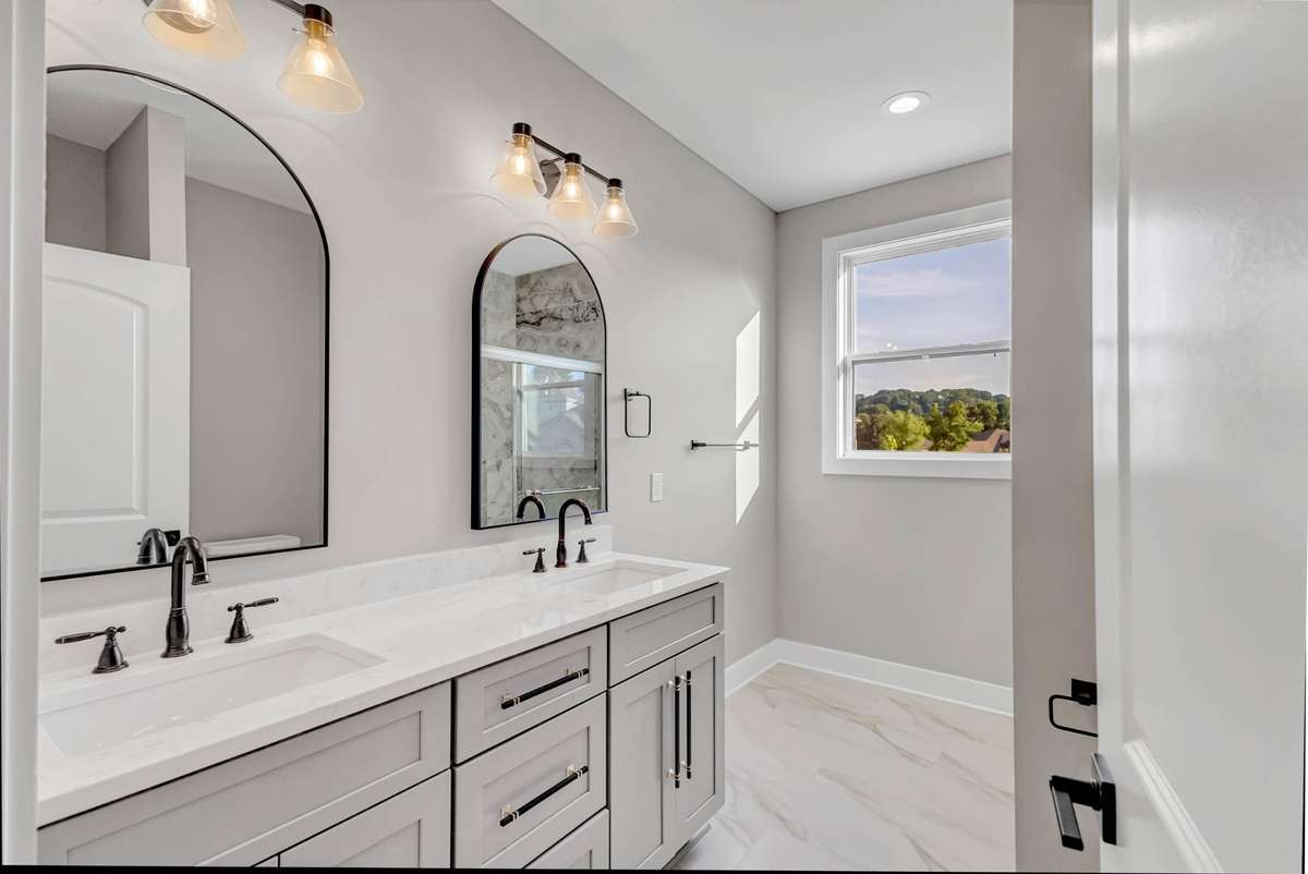 upstairs hall bath  with double vanities-one of two bathrooms upstairs