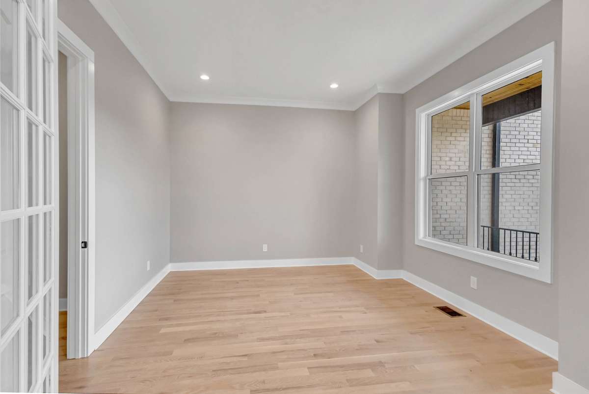 to the right of the entry foyer is a private office