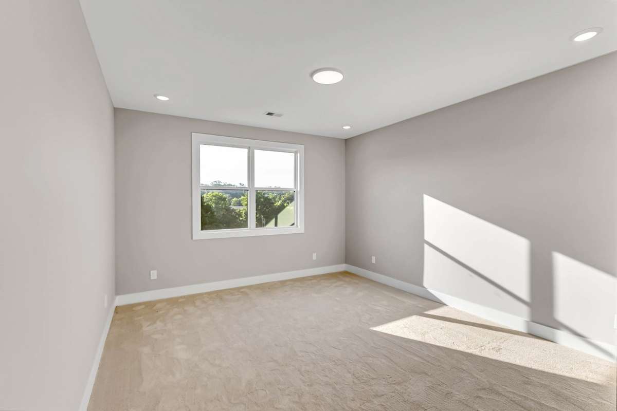 One of the upstairs bedrooms, carpeted for comfort
