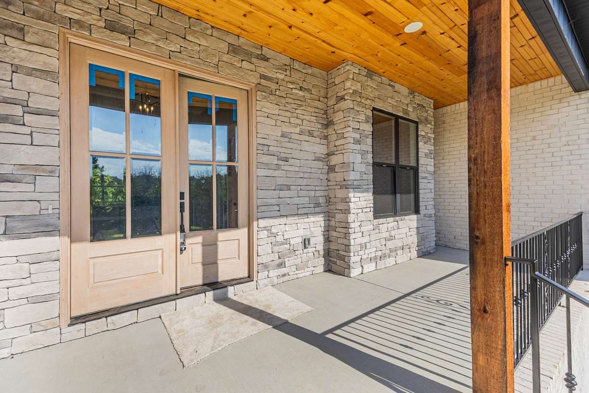 Wood detail on the porch ceiling adds a comfortable and warm feel!