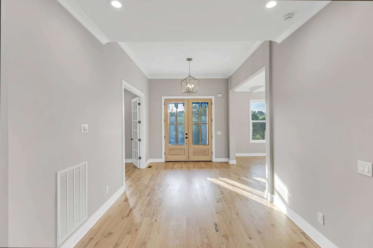 Another view of the foyer and stately double doors!