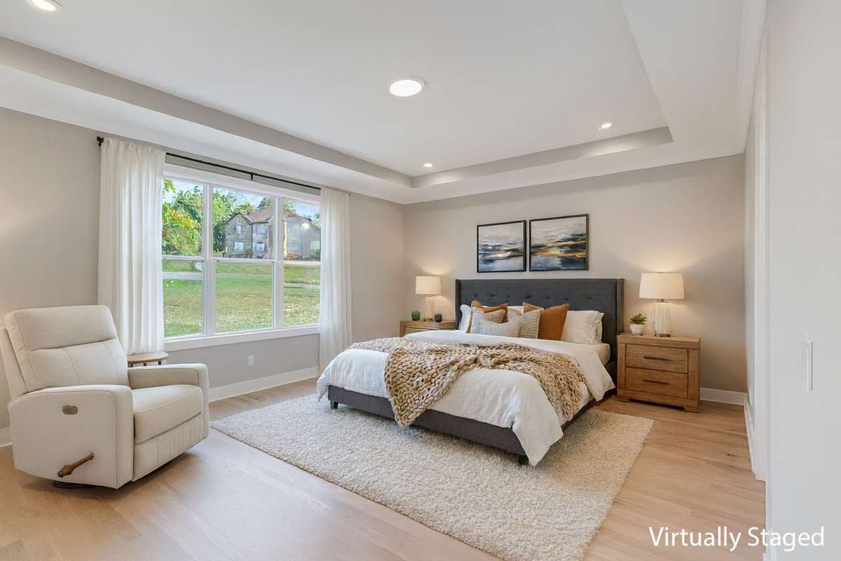 The primary suite is full of natural light and is so spacious! (virtually staged)