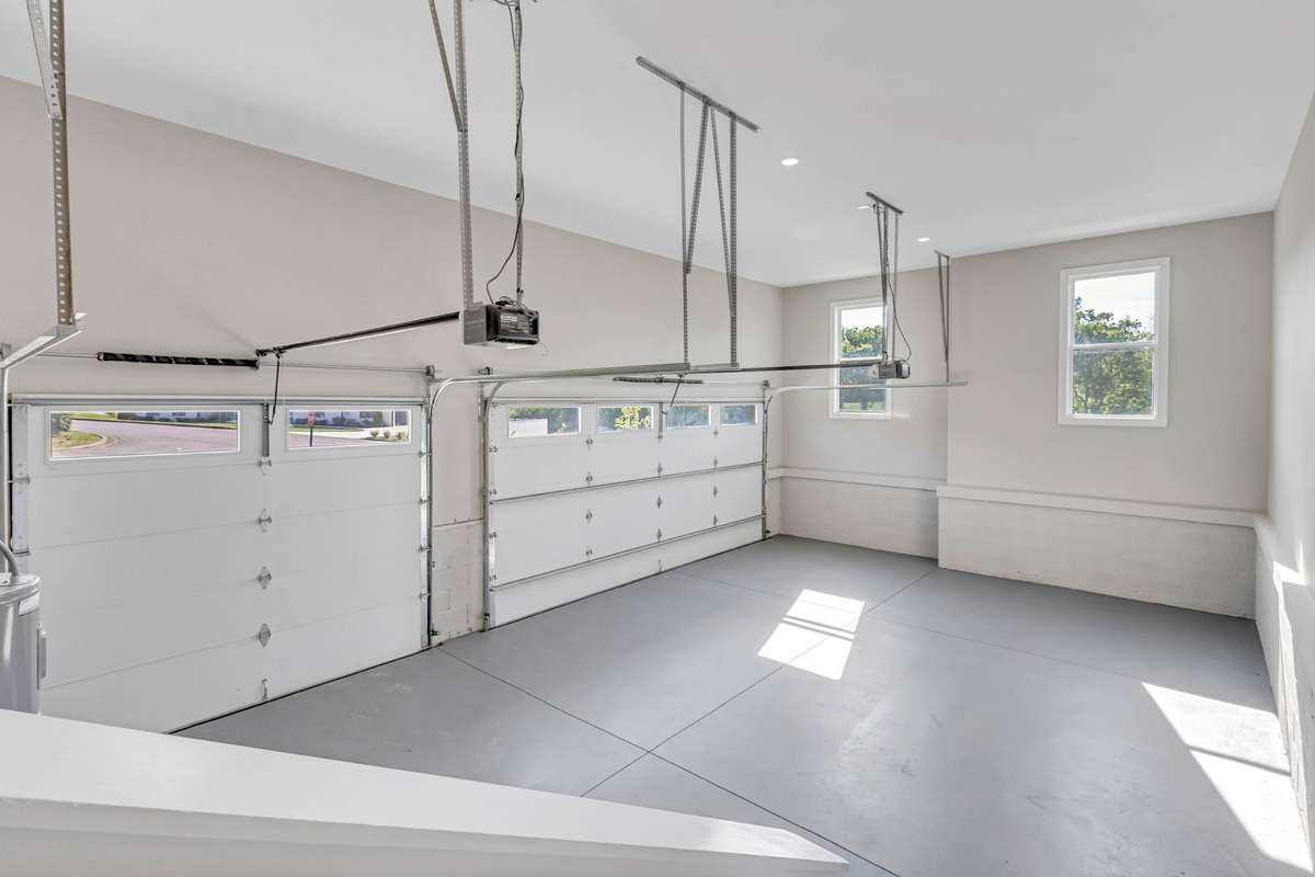 A TRUE 3 Car garage with tons of room for ceiling storage