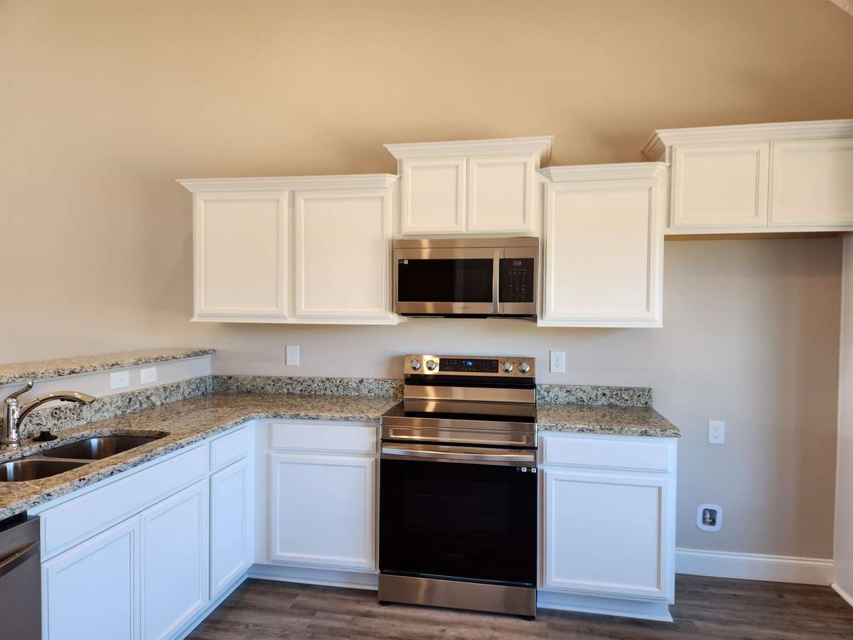 Lot 149 Valley Farms will have Custom Cabinets and Granite Counter Tops.  Picture of Similar House.