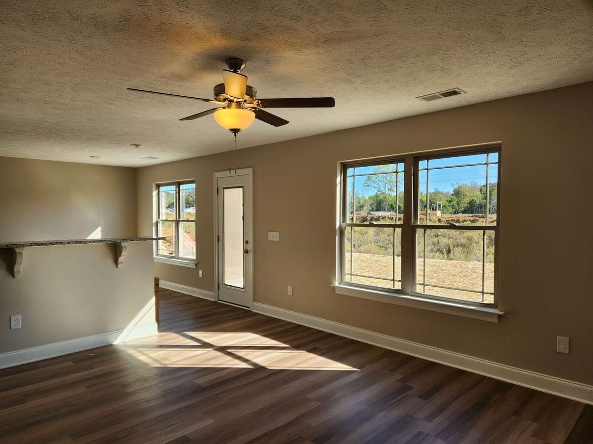 Spacious Living Room has Beautiful & Durable Plank Flooring!