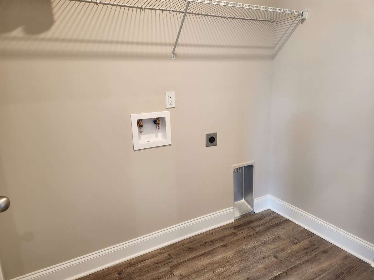Separate Laundry Room with LV Plank Flooring that is Waterproof. 
Picture of Similar House.