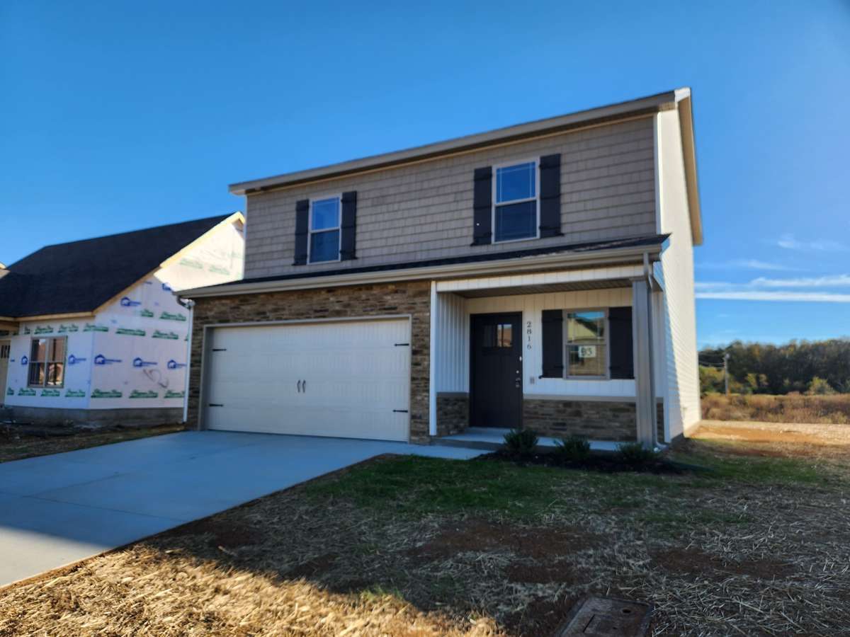 House will have Brown & Tan Stacked Stone and a Covered Front Porch.
Picture of Similar House.