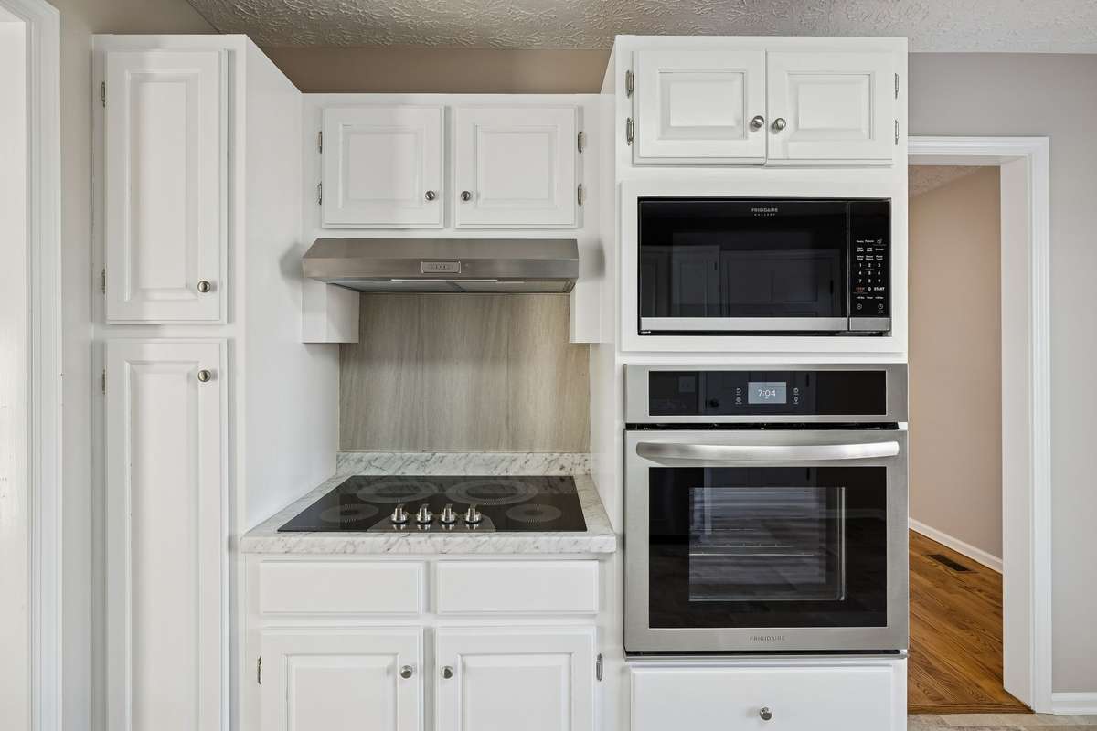 Classic kitchen design with built-in oven configuration...