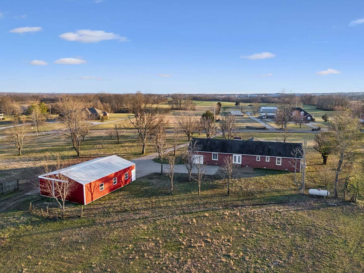 5.1-acre property with detached shop building...
