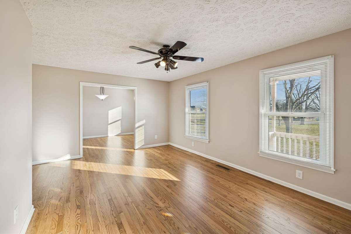 Move-in ready living room with timeless hardwoods...