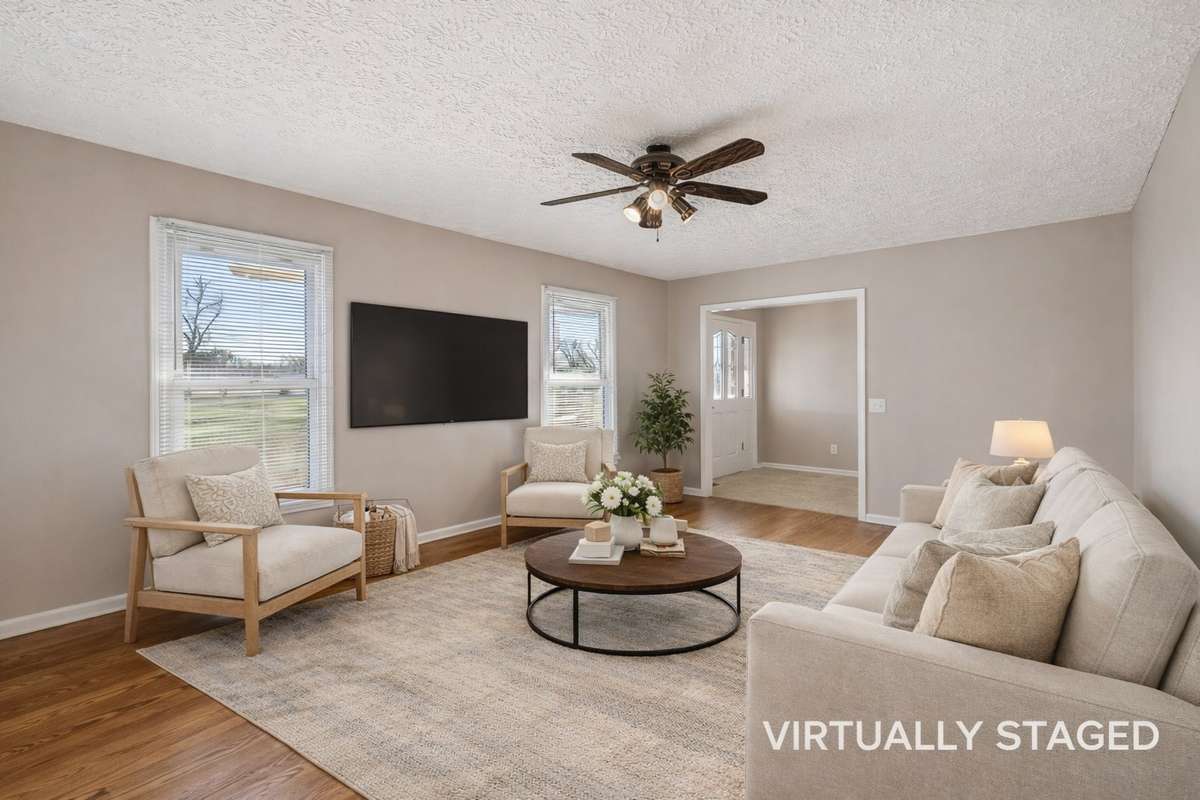 Hardwood flooring throughout main living area..