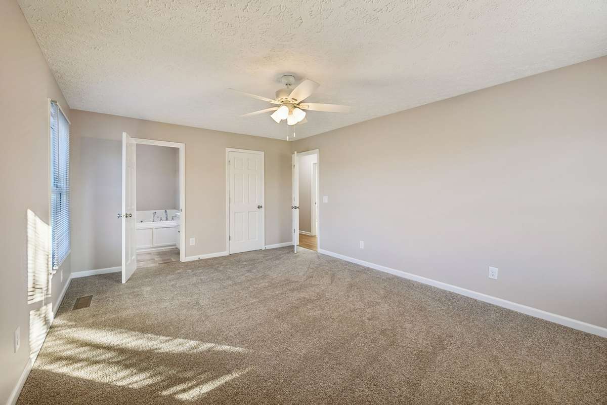 Primary suite with walk-in closet...