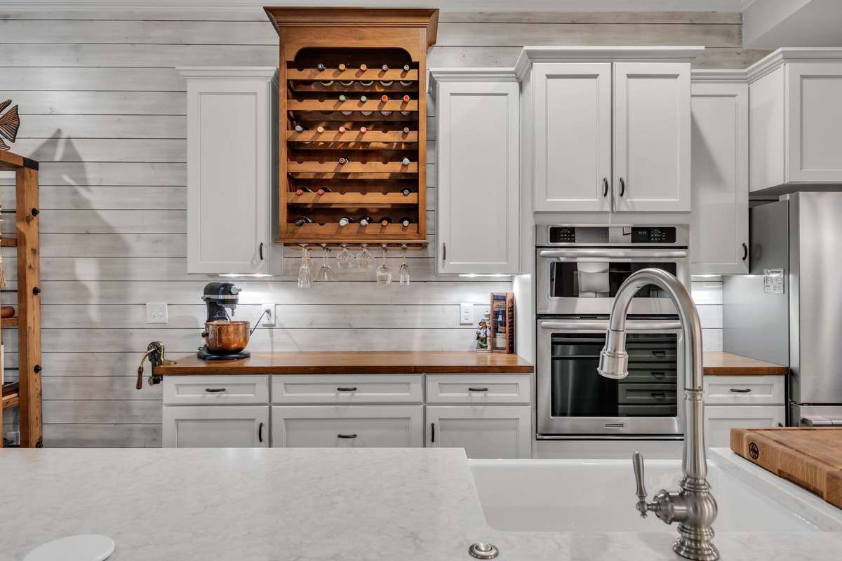 Gourmet Kitchen With Farm House Sink 
Double Ovens, Plus a single oven Cafe Induction 
Stove Top and a Master Wine Case with Butcher Block