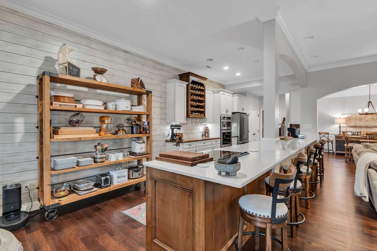 Got to Love this 20' Quartz Co. Top and stools
The Storage is great, too for Whatever you 
like - Shiplap on the wall