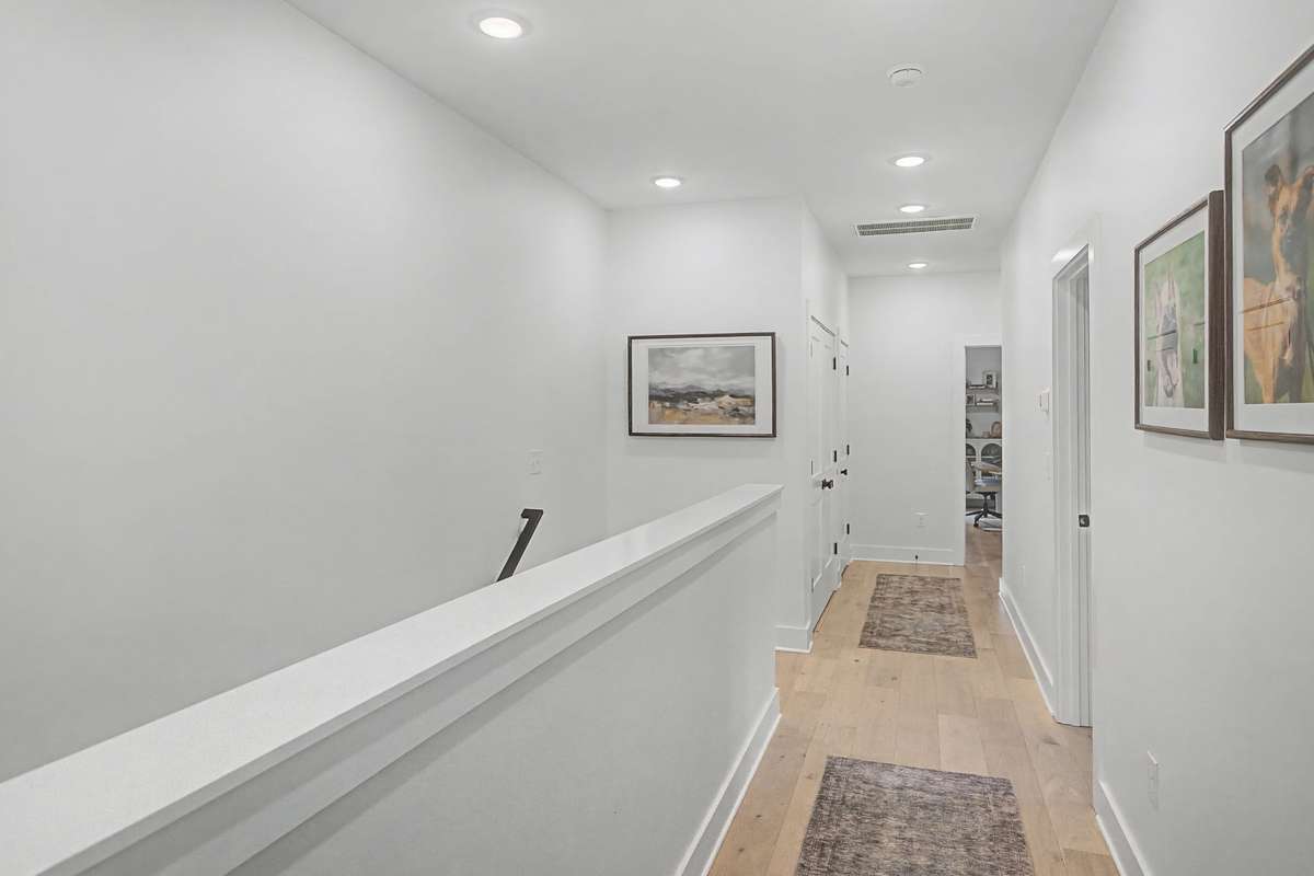 Spacious Upstairs Hallway Connecting the Bedrooms and Laundry Room with a Comfortable Flow Throughout the Second Floor