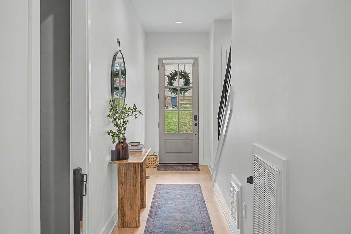 Welcoming Entryway and Black Hardware Throughout