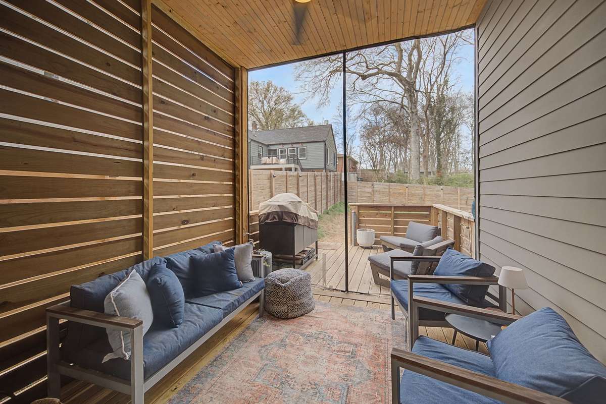Inviting Covered Porch and an Outside Deck Creates a Wonderful Outdoor Living Space