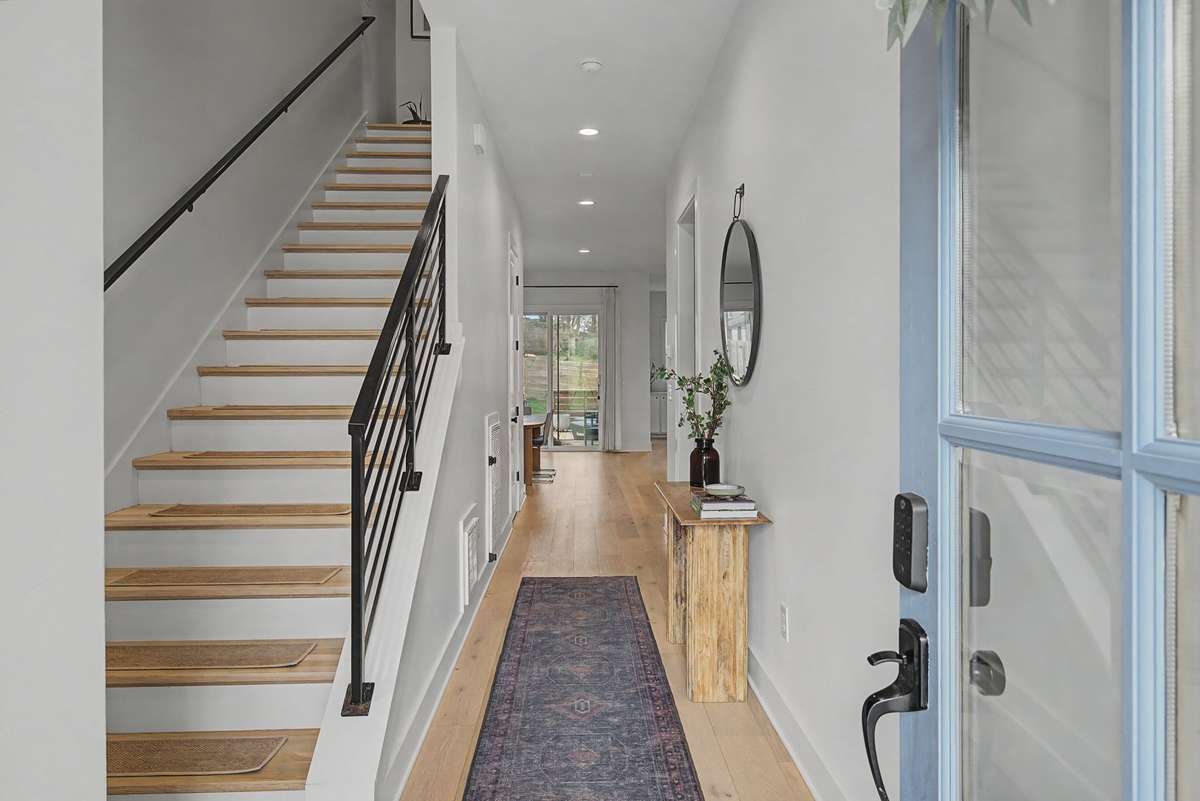 4 Bedrooms Upstairs with a Beautiful Staircase Leading to Them