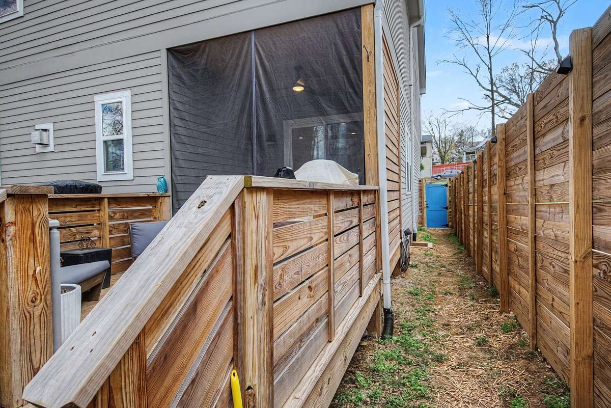 Access to the Front Yard to the Backyard Instead of Running Through the House! Love that Periwinkle Door!