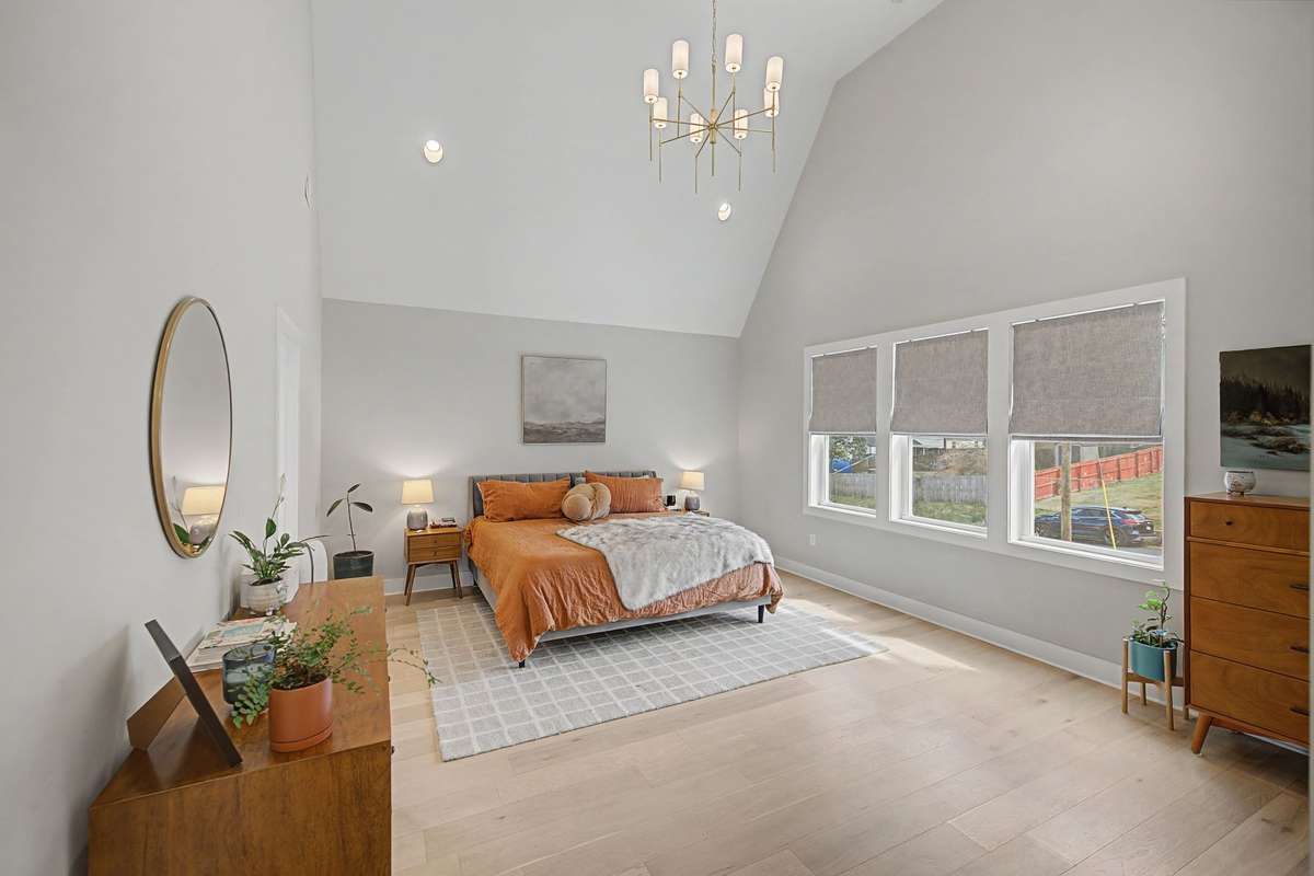 Impressive Primary Suite with a Beautiful En Suite Bath Including a Soaking Tub and Separate Shower, PLUS an OVERSIZED Walk-In Closet with Abundant Space for Clothing and Shoes
