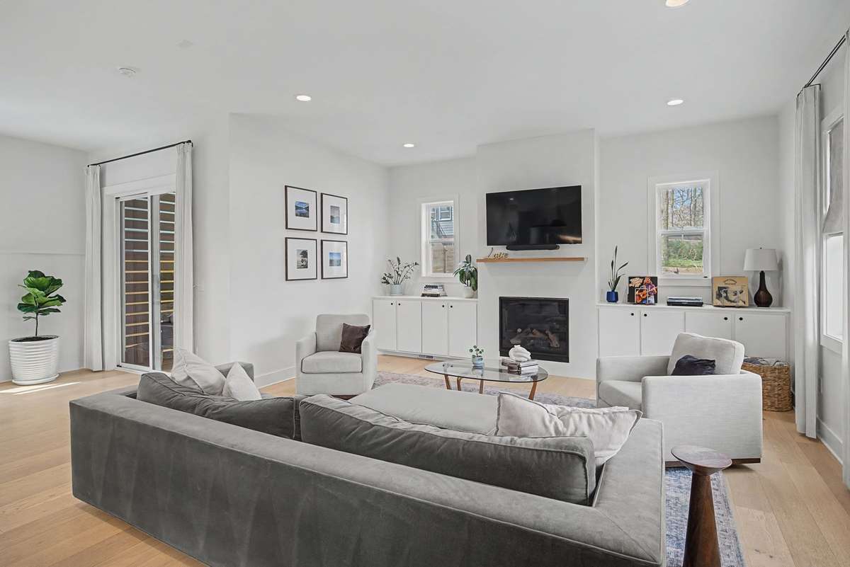 Cozy Fireplace Framed by Beautiful Built-in Storage on Both Sides Blending Warmth with Functional Design.