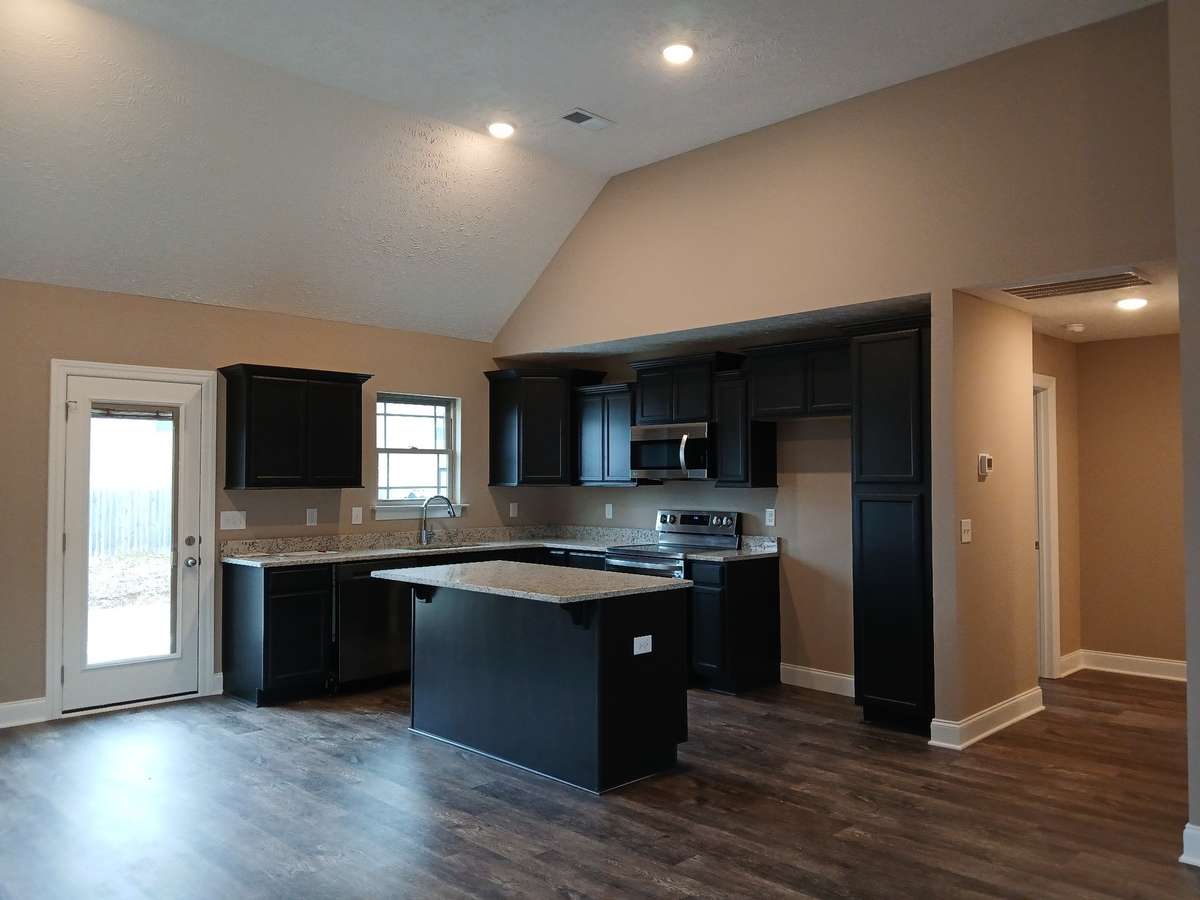 Spacious Kitchen with Custom Cabinets and Granite Counter Tops!
Previous House is shown.