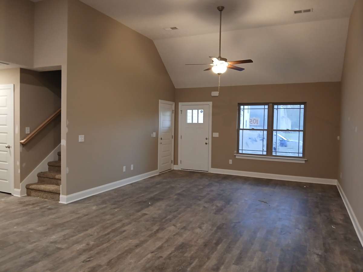 Spacious Living Room with Double Windows for Natural Light.  Picture of Previous House.